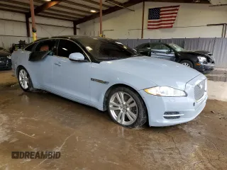2013 Jaguar XJ with VIN SAJWJ1CD1D8V51462, listed as a Copart auction lot 50527985 with 62,995 mi miles and Salvage title. Bid and sale history available at DreamBid. Image 4.
