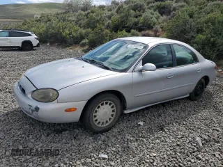1999 Mercury Sable GS z VIN 1MEFM50U7XG650801, wystawiony jako Copart lot #56764005 z przebiegiem 190 763 mil mil oraz Szkoda całkowita • Salvage title. Historia ofert i sprzedaży dostępna na DreamBid. Obrazek 1.