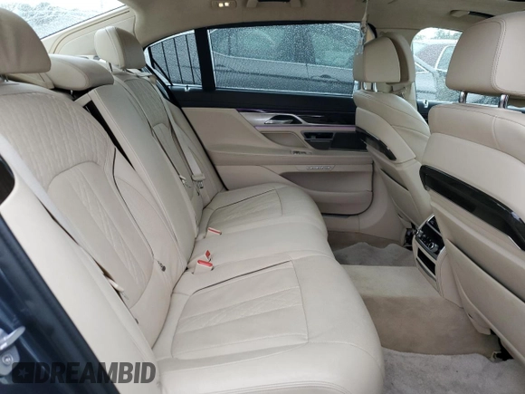 2016 BMW 7 Series 750i with VIN WBA7F0C54GGL99661, listed as a Copart auction lot 71742154 with 104,498 mi miles and Salvage Title. Bid and sale history available at carsss.com. Image 10.