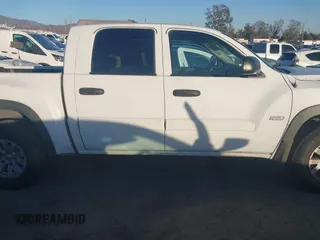 2006 Mitsubishi Raider Duro Cross with VIN 1Z7HC38K36S576409, listed as a IAAI auction lot 41410982 with 152,476 mi miles. Bid and sale history available at carsss.com. Image 13.