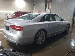 2015 Audi A8 with VIN WAUJGAFD1FN011100, listed as a Copart auction lot 49166055 with 38,575 mi miles and Salvage title. Bid and sale history available at DreamBid. Image 3.