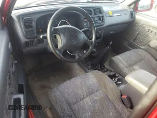 1999 Nissan Frontier XE with VIN 1N6ED26Y2XC312863, listed as a Copart auction lot 42259015 with 212,666 mi miles and Salvage title. Bid and sale history available at DreamBid. Image 8.
