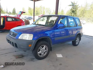 2001 Honda CR-V EX with VIN JHLRD18641C053166, listed as a IAAI auction lot 42078219 with 157,355 mi miles and . Bid and sale history available at DreamBid. Image 2.