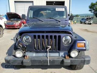 1999 Jeep Wrangler Sport with VIN 1J4FY19S6XP445867, listed as a Copart auction lot 62223125 with 146,037 mi miles and Salvage title. Bid and sale history available at DreamBid. Image 5.