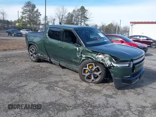 2022 Rivian R1T Adventure z VIN 7FCTGAAA8NN015369, wystawiony jako IAAI lot #41407842 z przebiegiem 22 507 mil mil oraz . Historia ofert i sprzedaży dostępna na DreamBid. Obrazek 1.