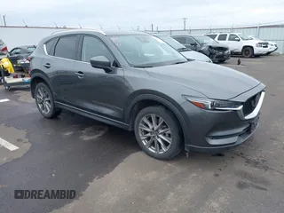 2020 Mazda CX-5 Grand Touring with VIN JM3KFBDM4L0829861, listed as a IAAI auction lot 41826250 with 62,091 mi miles and . Bid and sale history available at carsss.com. Image 1.
