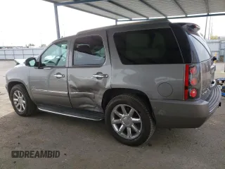 2012 GMC Yukon Denali with VIN 1GKS1EEFXCR236823, listed as a Copart auction lot 49830405 with 134,568 mi miles and Salvage Title. Bid and sale history available at carsss.com. Image 2.