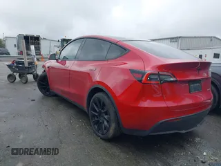 2021 Tesla Model Y Long Range with VIN 5YJYGDEE5MF085032, listed as a IAAI auction lot 41982925 with 64,541 mi miles and . Bid and sale history available at carsss.com. Image 3.