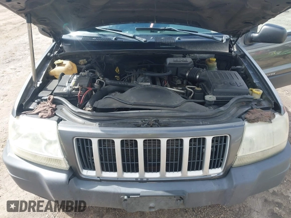 2004 Jeep Grand Cherokee Laredo z VIN 1J4GW48SX4C213322, wystawiony jako IAAI lot #41969362 z przebiegiem 273 876 mil mil oraz . Historia ofert i sprzedaży dostępna na DreamBid. Obrazek 10.