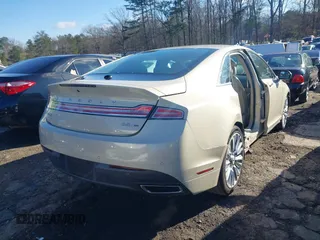 2016 Lincoln MKZ z VIN 3LN6L2G9XGR605070, wystawiony jako IAAI lot #41705442 z przebiegiem 136 565 mil mil oraz . Historia ofert i sprzedaży dostępna na DreamBid. Obrazek 17.