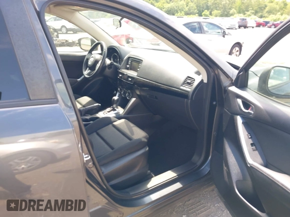 2015 Mazda CX-5 Touring with VIN JM3KE4CY9F0506879, listed as a IAAI auction lot 42209768 with 87,690 mi miles and . Bid and sale history available at DreamBid. Image 5.