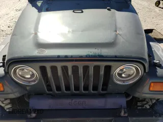 2002 Jeep Wrangler Sahara with VIN 1J4FA59S02P761365, listed as a Copart auction lot 81899144 with 208,429 mi miles and Salvage title. Bid and sale history available at DreamBid. Image 12.