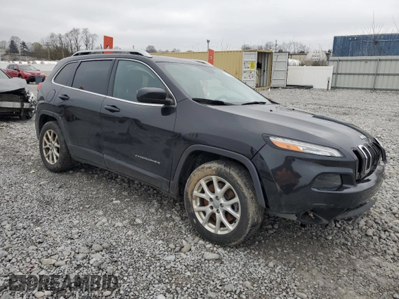 2015 Jeep Cherokee Latitude with VIN 1C4PJLCB9FW706934, listed as a Copart auction lot 52696105 with 125,205 mi miles and Salvage Title. Bid and sale history available at DreamBid. Image 4.