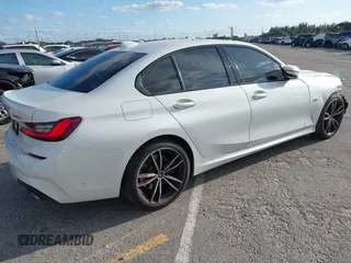 2022 BMW 3 Series 330e with VIN 3MW5P7J08N8C65252, listed as a IAAI auction lot 41229681 with 27,606 mi miles. Bid and sale history available at carsss.com. Image 4.