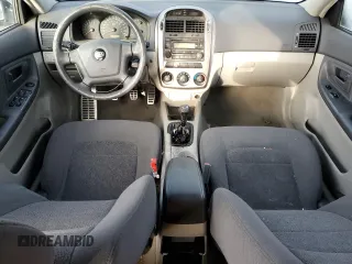 2005 Kia Spectra with VIN KNAFE161655093051, listed as a Copart auction lot 77821904 with 104,874 mi miles and Salvage Title. Bid and sale history available at carsss.com. Image 8.