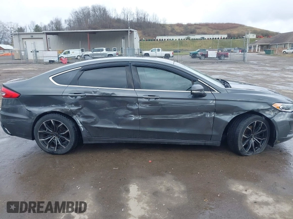 2019 Ford Fusion SEL with VIN 3FA6P0CD6KR141832, listed as a IAAI auction lot 41800102 with 142,282 mi miles and . Bid and sale history available at DreamBid. Image 14.