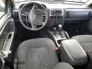 2004 Jeep Grand Cherokee Laredo with VIN 1J4GW48S84C184757, listed as a Copart auction lot 52895745 with 242,307 mi miles and Salvage Title. Bid and sale history available at carsss.com. Image 8.