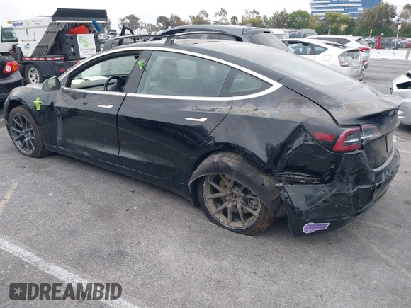 2019 Tesla Model 3 Mid Range with VIN 5YJ3E1EA2KF362048, listed as a IAAI auction lot 40141734 with 70,321 mi miles and . Bid and sale history available at carsss.com. Image 13.
