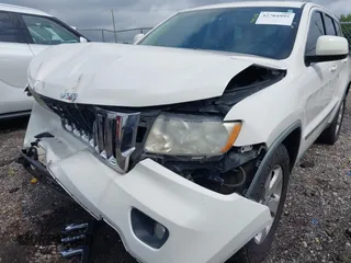 2011 Jeep Grand Cherokee Laredo with VIN 1J4RR4GG7BC701007, listed as a IAAI auction lot 42704995 with 145,956 mi miles and . Bid and sale history available at DreamBid. Image 15.