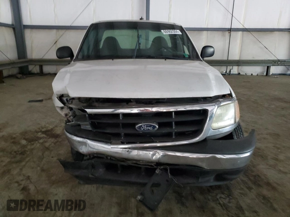 2000 Ford F-150 XL с VIN 1FTPF17L1YKA92061, выставлен на аукционе Copart как лот 66962304 с пробегом Не указан миль и Списание • Salvage title. История ставок и продаж доступна на DreamBid. Изображение 5.