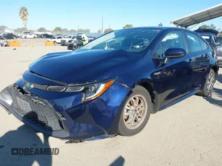 2021 Toyota Corolla Hybrid LE with VIN JTDEAMDEXMJ018828, listed as a IAAI auction lot 41633192 with 63,302 mi miles. Bid and sale history available at carsss.com. Image 18.