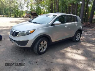 2012 Kia Sportage LX with VIN KNDPB3A22C7342085, listed as a IAAI auction lot 42313425 with 112,005 mi miles and . Bid and sale history available at DreamBid. Image 2.