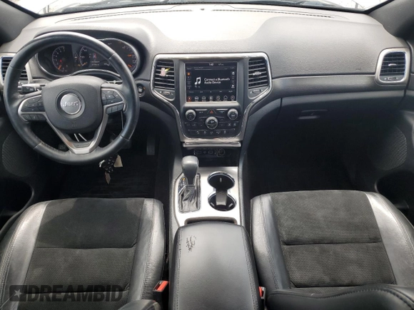 2018 Jeep Grand Cherokee Laredo E with VIN 1C4RJFAG0JC173200, listed as a Copart auction lot 55326805 with 127,489 mi miles and Salvage Title. Bid and sale history available at DreamBid. Image 8.
