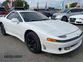 1992 Mitsubishi 3000GT z VIN JA3XE74CXNY058167, wystawiony jako Copart lot #84192254 z przebiegiem 69 411 mil mil oraz Tytuł czysty. Historia ofert i sprzedaży dostępna na DreamBid. Obrazek 1.
