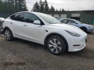 2023 Tesla Model Y Long Range with VIN 7SAYGDEE6PA101291, listed as a Copart auction lot 52758115 with 7,250 mi miles and Salvage Title. Bid and sale history available at DreamBid. Image 4.