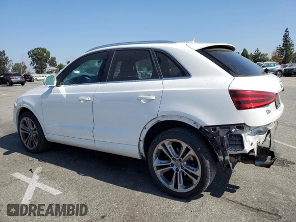 2015 Audi Q3 Premium Plus with VIN WA1BFCFS0FR001987, listed as a Copart auction lot 72962684 with 104,432 mi miles and Salvage title. Bid and sale history available at DreamBid. Image 2.