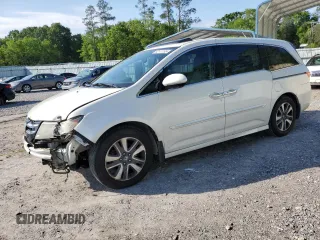 2016 Honda Odyssey Touring Elite with VIN 5FNRL5H97GB129217, listed as a Copart auction lot 52177765 with 138,045 mi miles and Salvage Title. Bid and sale history available at DreamBid. Image 1.