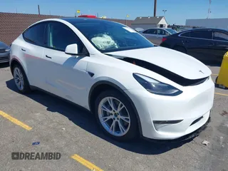 2023 Tesla Model Y Long Range with VIN 7SAYGAEE4PF851063, listed as a IAAI auction lot 42327656 with 21,644 mi miles and . Bid and sale history available at DreamBid. Image 1.