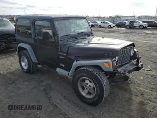 2002 Jeep Wrangler Sport with VIN 1J4FA49S32P758082, listed as a Copart auction lot 80692073 with 148,784 mi miles and Salvage Title. Bid and sale history available at carsss.com. Image 4.