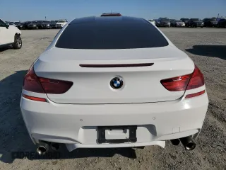 2014 BMW M6 z VIN WBSLX9C51ED160143, wystawiony jako Copart lot #50762185 z przebiegiem 91 718 mil mil oraz Szkody całkowita. Historia ofert i sprzedaży dostępna na DreamBid. Obrazek 6.