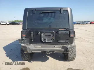 2013 Jeep Wrangler Unlimited Freedom z VIN 1C4BJWDG0DL513902, wystawiony jako Copart lot #52045975 z przebiegiem 166 827 mil mil oraz Szkoda całkowita • Salvage title. Historia ofert i sprzedaży dostępna na DreamBid. Obrazek 6.
