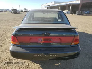 1996 Saturn SL z VIN 1G8ZK527XTZ335205, wystawiony jako Copart lot #42230735 z przebiegiem 82 344 mil mil oraz Szkoda całkowita • Salvage title. Historia ofert i sprzedaży dostępna na DreamBid. Obrazek 6.