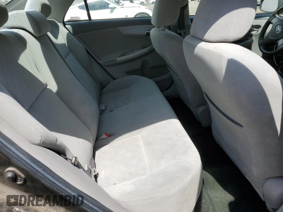 2010 Toyota Corolla z VIN 2T1BU4EE9AC197170, wystawiony jako Copart lot #64015795 z przebiegiem 113 607 mil mil oraz Szkoda całkowita • Salvage title. Historia ofert i sprzedaży dostępna na DreamBid. Obrazek 10.