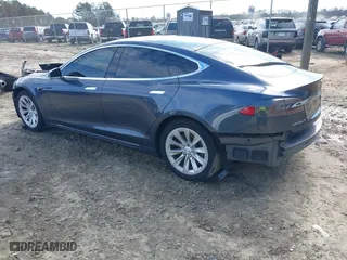 2017 Tesla Model S 100D with VIN 5YJSA1E23HF198592, listed as a IAAI auction lot 41721755 with 127,946 mi miles. Bid and sale history available at carsss.com. Image 3.