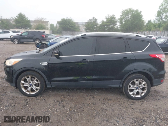 2014 Ford Escape Titanium with VIN 1FMCU9J90EUC24898, listed as a IAAI auction lot 42166523 with 152,464 mi miles and . Bid and sale history available at DreamBid. Image 14.
