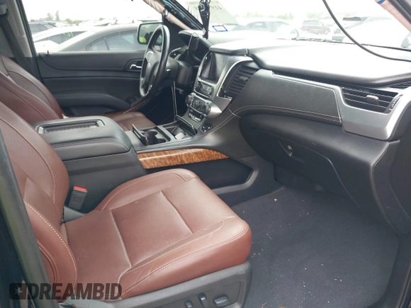 2019 Chevrolet Suburban Premier with VIN 1GNSKJKJ3KR231852, listed as a IAAI auction lot 41957728 with 136,263 mi miles and . Bid and sale history available at DreamBid. Image 5.
