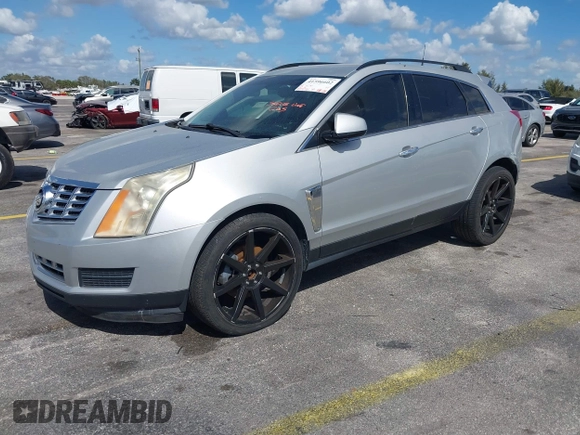 2013 Cadillac SRX z VIN 3GYFNAE32DS512534, wystawiony jako IAAI lot #41596602 z przebiegiem 193 131 mil mil oraz . Historia ofert i sprzedaży dostępna na DreamBid. Obrazek 2.