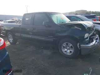 1999 Chevrolet Silverado 1500 LS with VIN 2GCEC19T4X1165256, listed as a IAAI auction lot 41236272 with 77,004 mi miles. Bid and sale history available at carsss.com. Image 14.