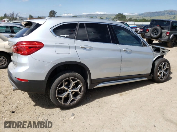2018 BMW X1 sDrive28i with VIN WBXHU7C38J3H42948, listed as a Copart auction lot 52061793 with 26,991 mi miles and . Bid and sale history available at DreamBid. Image 3.