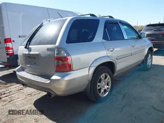 2004 Acura MDX Touring Pkg with VIN 2HNYD18694H521669, listed as a IAAI auction lot 42040542 with 294,325 mi miles. Bid and sale history available at carsss.com. Image 4.
