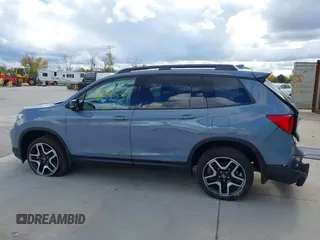 2023 Honda Passport Elite with VIN 5FNYF8H03PB000039, listed as a IAAI auction lot 40593339 with 33,697 mi miles and . Bid and sale history available at DreamBid. Image 14.