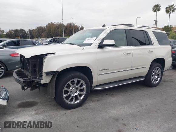 2015 GMC Yukon Denali with VIN 1GKS2CKJ9FR294551, listed as a IAAI auction lot 42162654 with 106,063 mi miles. Bid and sale history available at carsss.com. Image 19.