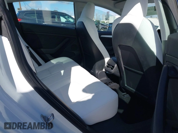 2023 Tesla Model 3 with VIN 5YJ3E1EA6PF495631, listed as a IAAI auction lot 41568118 with 10,073 mi miles and . Bid and sale history available at DreamBid. Image 8.