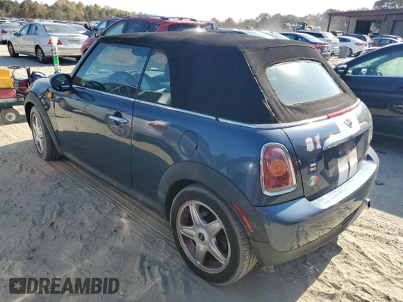 2009 MINI Convertible with VIN WMWMR33559TU96728, listed as a Copart auction lot 77949004 with 86,084 mi miles and Clean title. Bid and sale history available at DreamBid. Image 2.