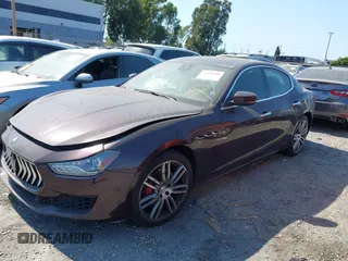2018 Maserati Ghibli with VIN ZAM57XSA0J1286682, listed as a IAAI auction lot 42489500 with 50,169 mi miles and . Bid and sale history available at DreamBid. Image 2.