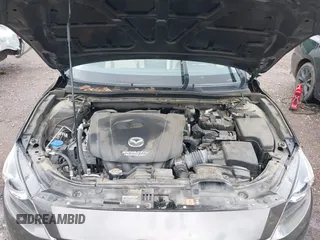 2016 Mazda 3 S Grand Touring z VIN JM1BM1N33G1277798, wystawiony jako IAAI lot #42337611 z przebiegiem 91 519 mil mil oraz . Historia ofert i sprzedaży dostępna na DreamBid. Obrazek 10.